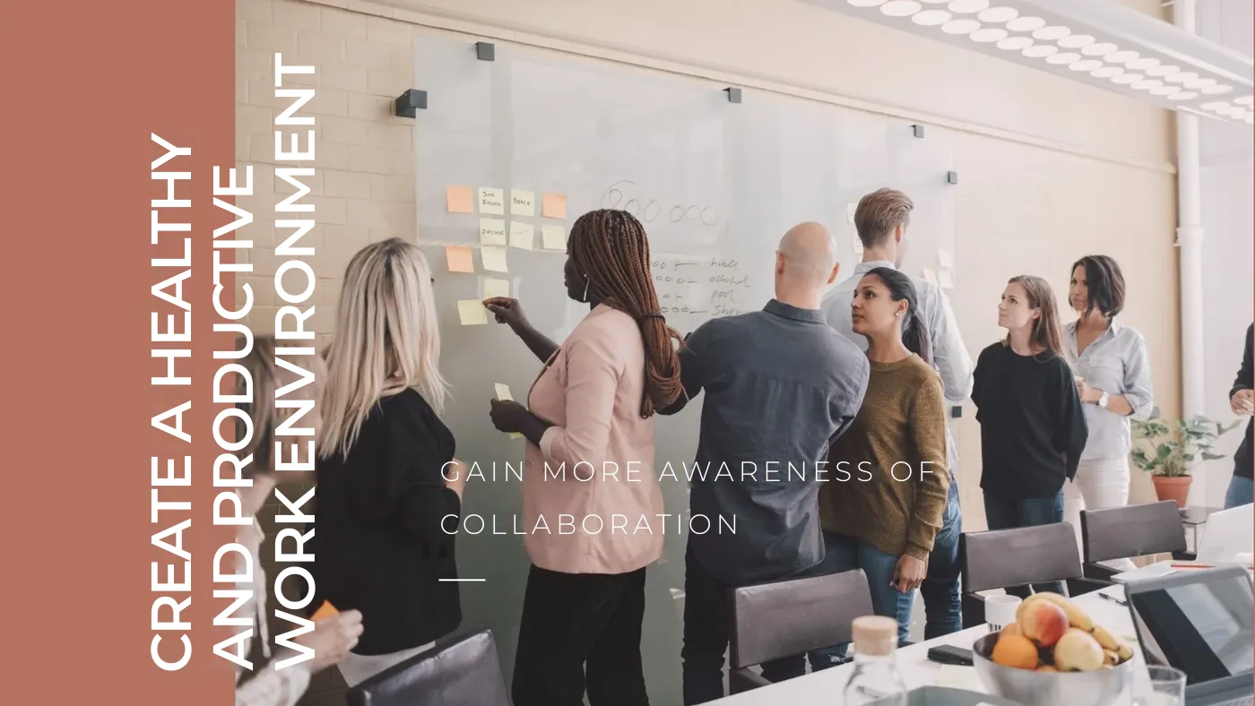 Colleagues collaborating on project planning at a whiteboard to promote a healthy and productive work environment.